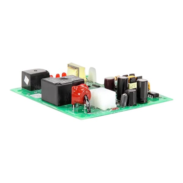 A green Scotsman service circuit board with various black and red electronic components and a white label.