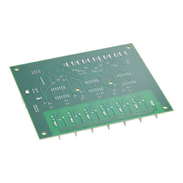 A close-up of a green Frymaster UHCHD distribution circuit board with many small holes.