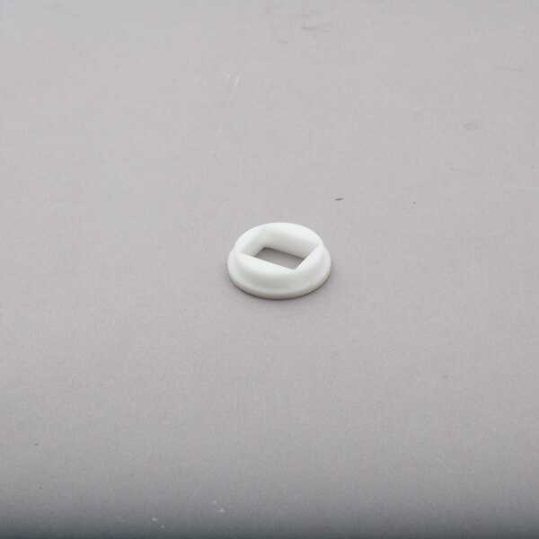 a white circle on a gray surface