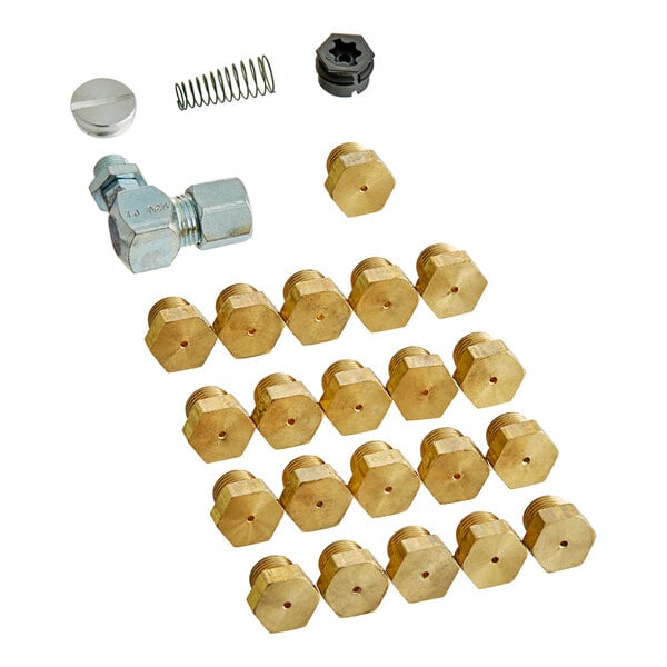 A close up of brass and gold nuts and bolts used in a Frymaster fryer conversion kit.