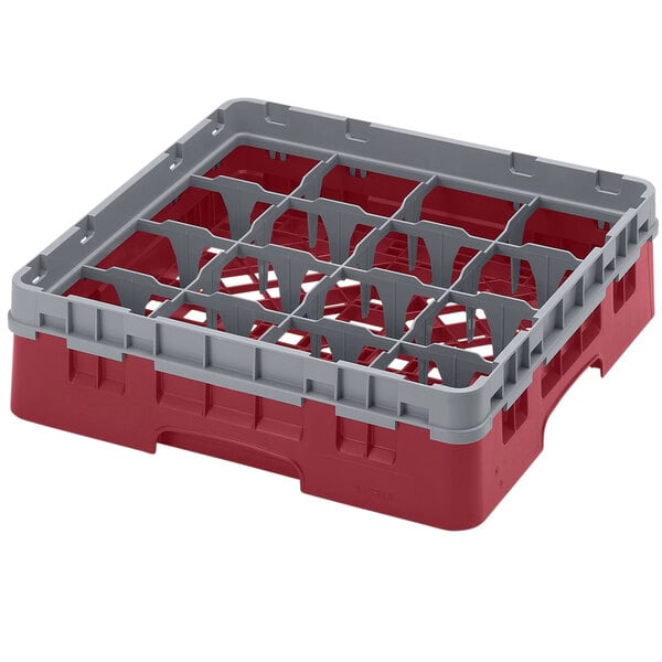 A red and gray plastic Cambro glass rack with 16 compartments and one extender.