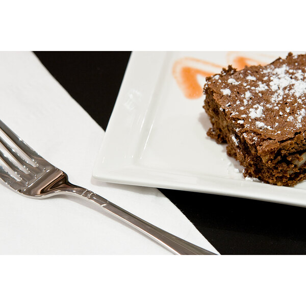 A Tuxton white rectangular china plate with a brownie on it and a fork.
