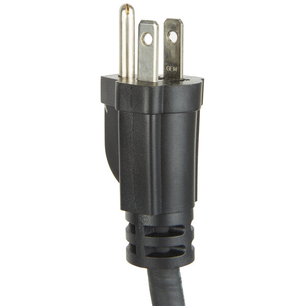 A close up of a black power cord with a white plug.