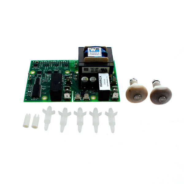 A Groen level control circuit board with two white plastic plugs and two white plastic tips.