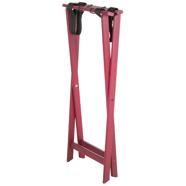 A mahogany wood tray stand with straps on a pair of legs.