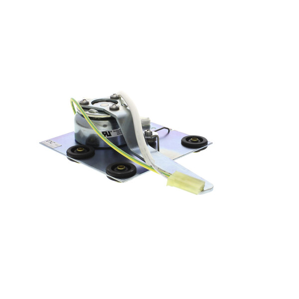 A Scotsman solenoid assembly with a white strip and green wire.