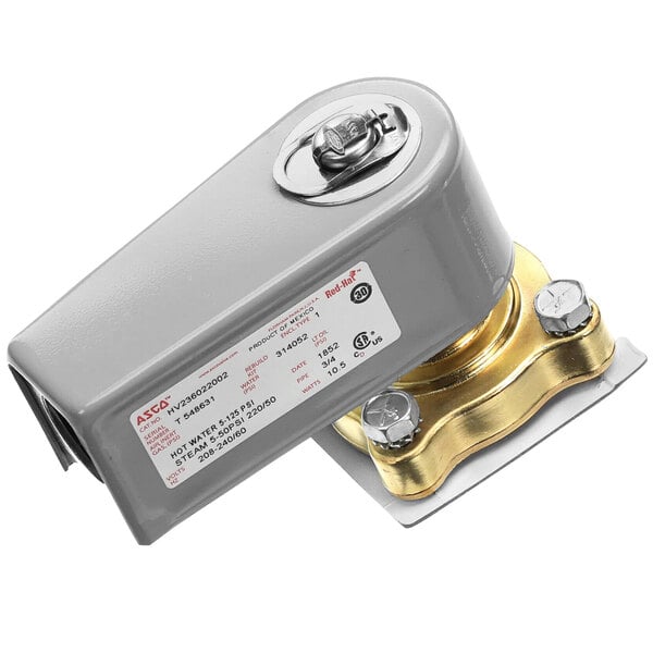 A close up of a grey metal Stero repair kit switch with a brass cover.