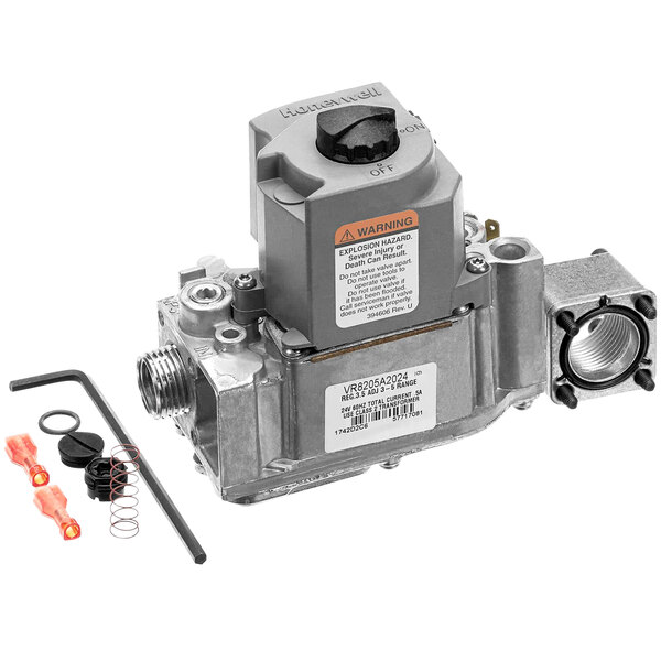 A grey Stero gas valve with black and red labels and a spring.