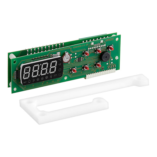A green electronic device with a white plastic case and white numbers on a green circuit board.