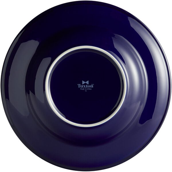 A blue Tuxton China soup/pasta bowl with a white rim.