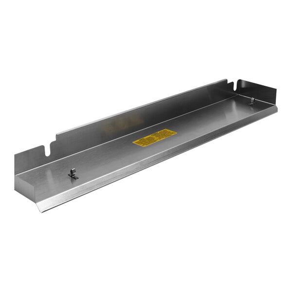 A metal rectangular Montague burner box shelf with a yellow label.