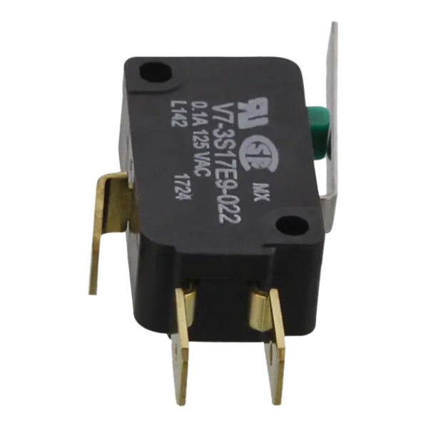 A black and gold electrical switch with a green and black lever.