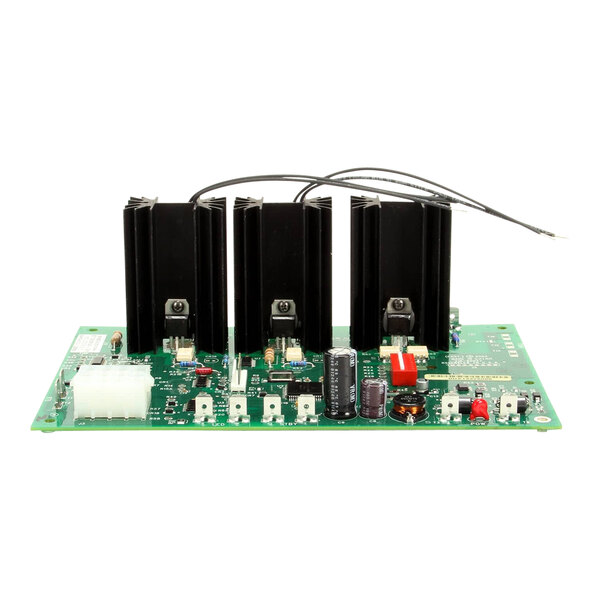 A green circuit board with three black electronic components.