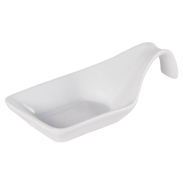 A white porcelain spoon with a curved handle.