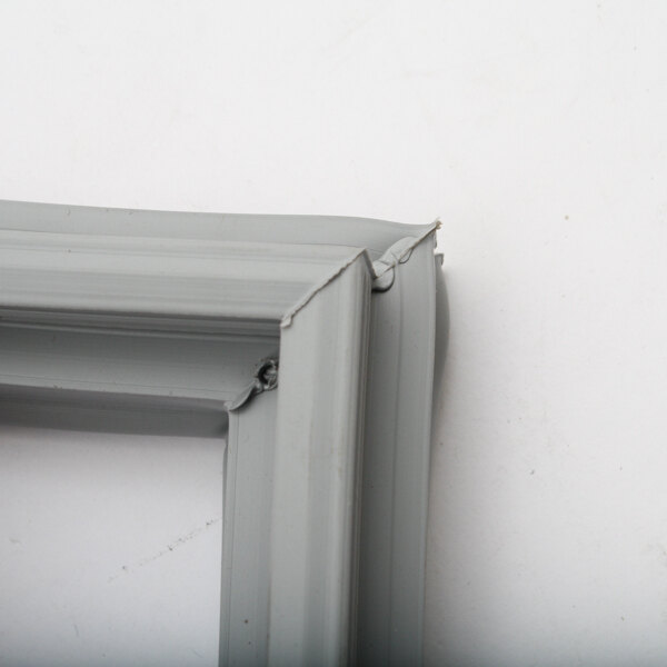 A close up of a Randell drawer gasket with a gray frame and a screw.