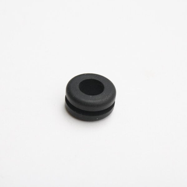 A close up of a black Metro grommet with a hole in it.