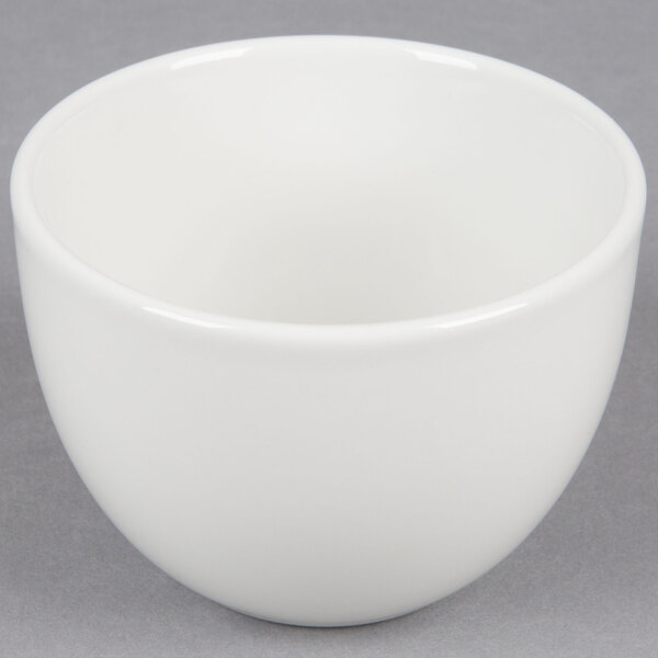 A Tuxton Florence bright white china bouillon cup on a gray surface.