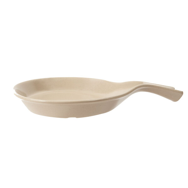 A GET Tahoe Sandstone skillet with a spoon in it.
