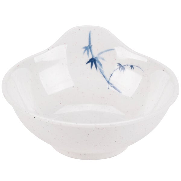 A white bowl with a blue and white speckled design.