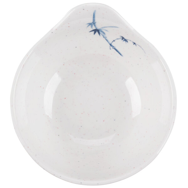 A white bowl with blue bamboo designs.
