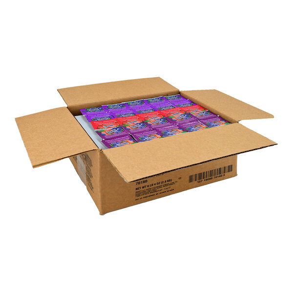 A case of Grape, Strawberry, & Mixed Fruit Jelly portion cups on a table.