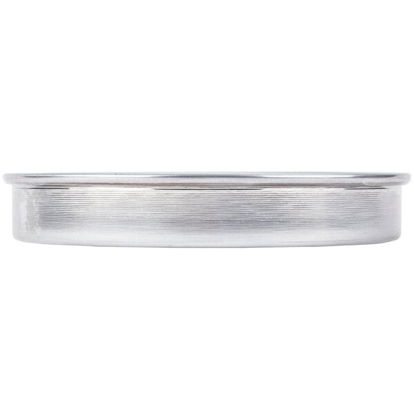 An American Metalcraft aluminum pizza pan with perforated round edges.