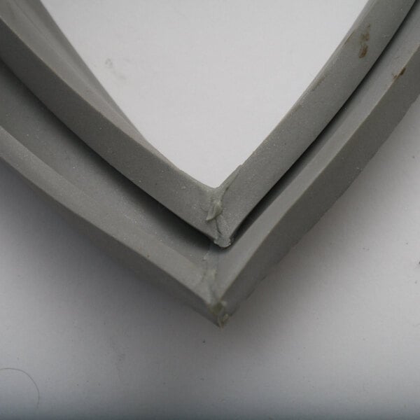 A grey rubber BKI door gasket corner.