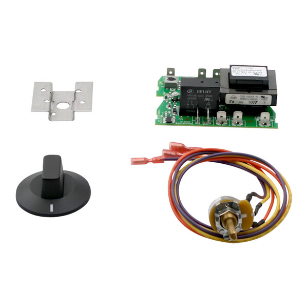 A Moffat thermostat control board with a wiring kit and other components on a circuit board.