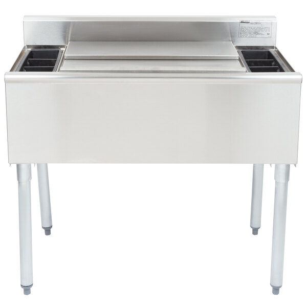 A stainless steel underbar cocktail and ice bin with bottle holders.