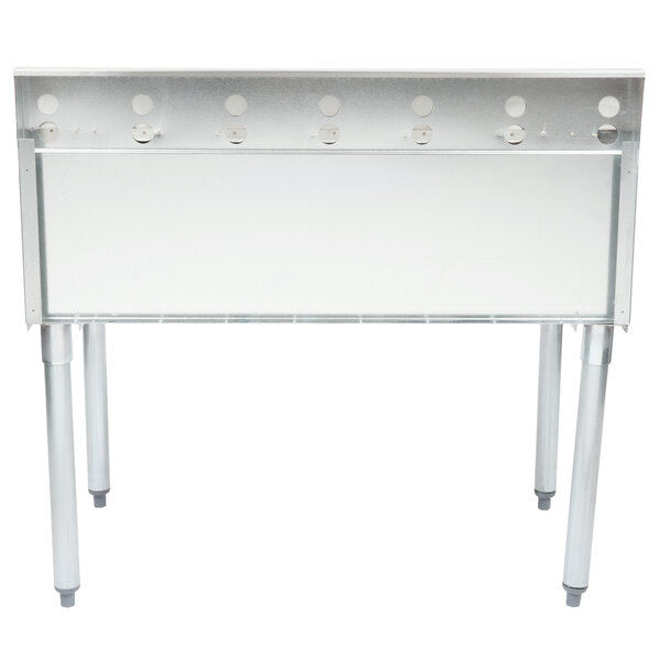 A stainless steel Eagle Group underbar cocktail and ice bin with bottle holders on a white table.