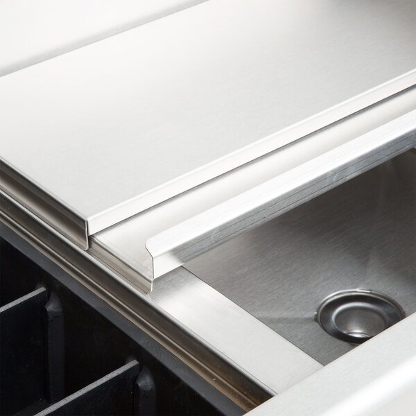 An Eagle Group underbar cocktail/ice bin with bottle holders and a stainless steel sink.