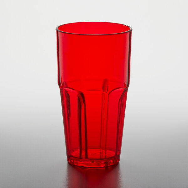 A red plastic GET Bahama tumbler on a white surface.