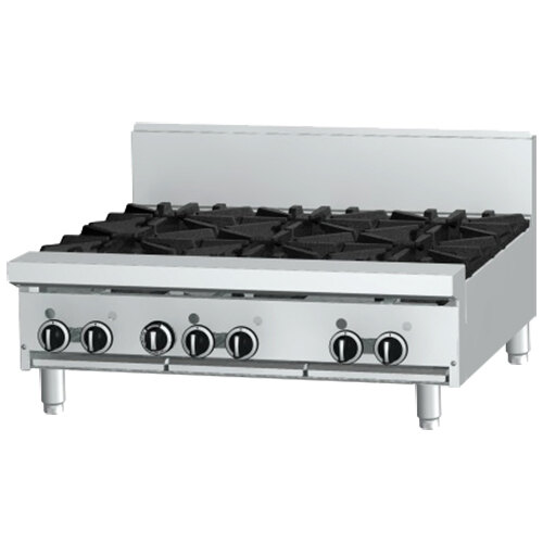 A stainless steel Garland countertop gas range with a griddle and four burners.