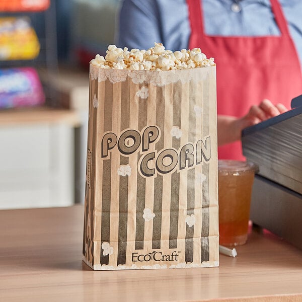 A Bagcraft EcoCraft popcorn bag on a counter.