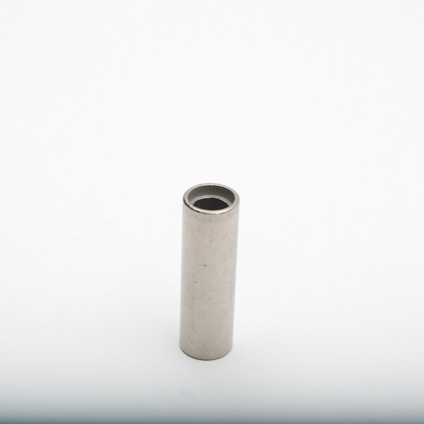 a white cylinder with black specks