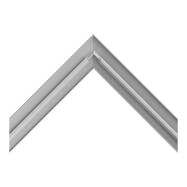 A metallic, V-shaped corner piece with a grooved design, likely part of a frame or trim.