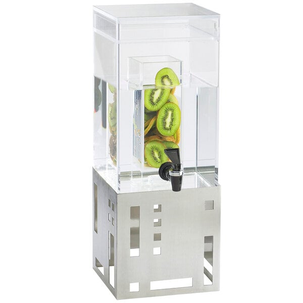 A Cal-Mil stainless steel beverage dispenser with kiwi fruit in the infusion chamber.