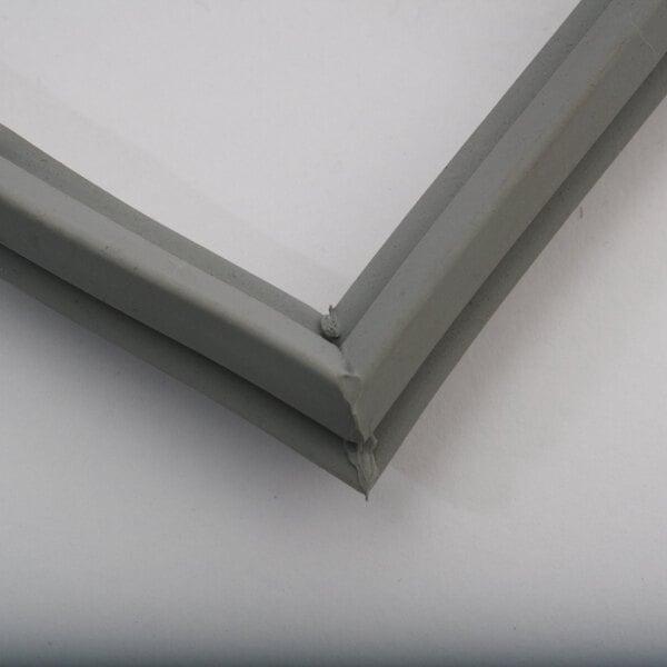 A close-up of a grey plastic corner piece.