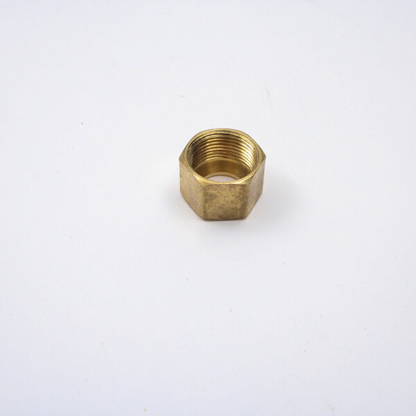 A close-up of a brass nut.