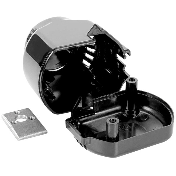 A black plastic container with a small metal piece.