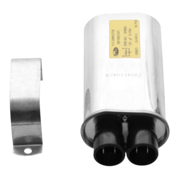 A stainless steel TurboChef capacitor with two metal connectors.