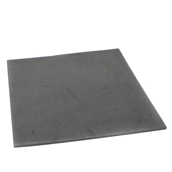 A black square Scotsman insulation tile on a white surface.