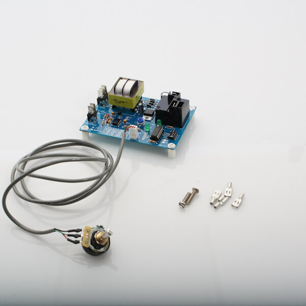 A blue NU-VU 425 solid state control circuit board with wires and screws.