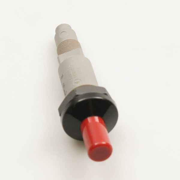 A close-up of a grey and black electrical device with red and black buttons.