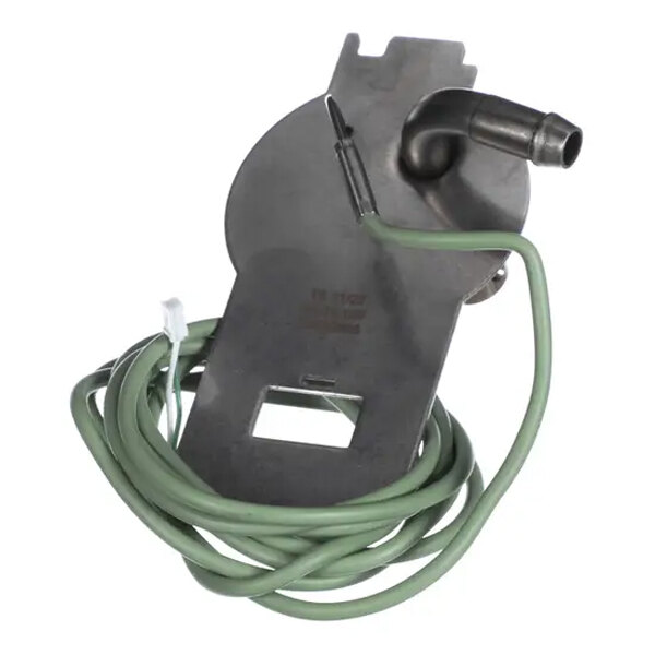 A metal piece with a green wire wrapped around it.