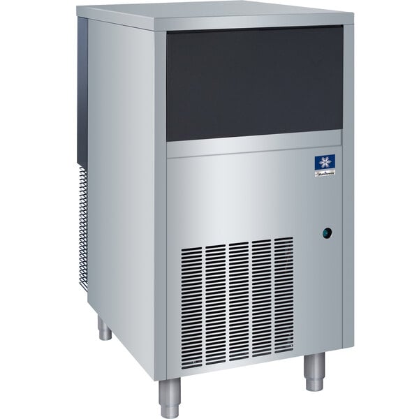 A large rectangular stainless steel Manitowoc undercounter ice machine.