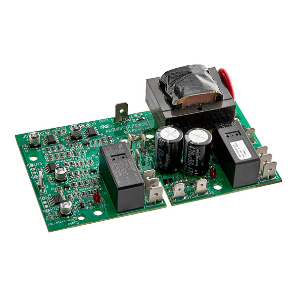 A close-up of a green circuit board with black and red electronic components.