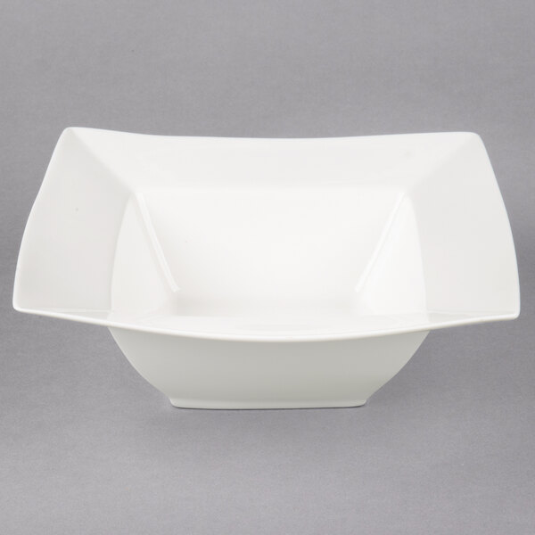 A white square bowl with a curved edge.