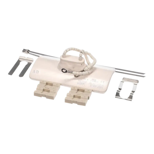 A white ceramic electrical device with metal parts and a wire.