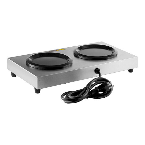 An Avantco double burner decanter warmer on a silver electric stove with two black round plates.